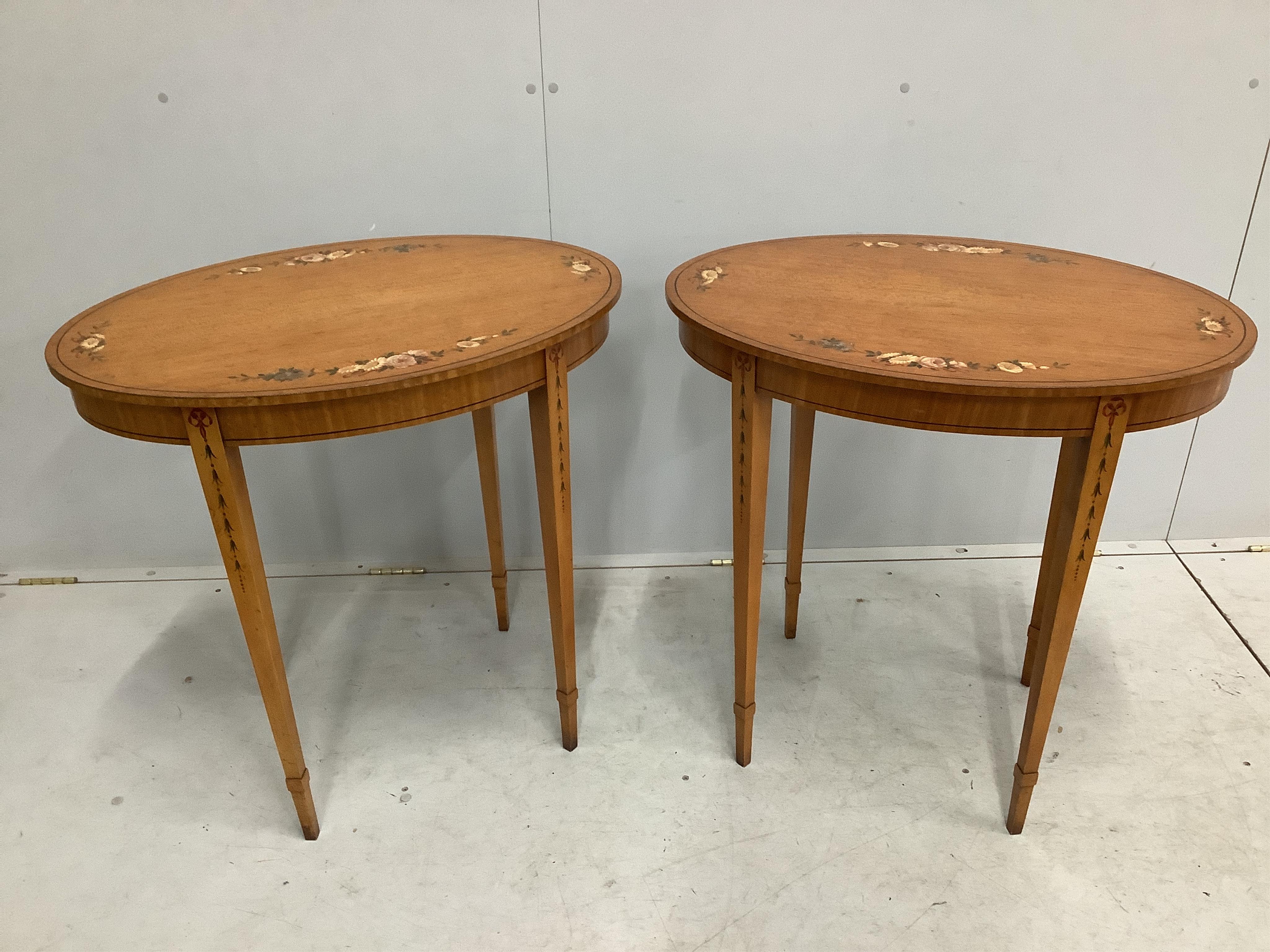 A pair of reproduction Sheraton style painted oval satinwood occasional tables, width 74cm, depth 52cm, height 74cm. Condition - good